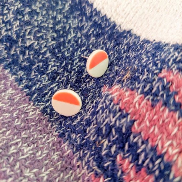 White and orange round earrings